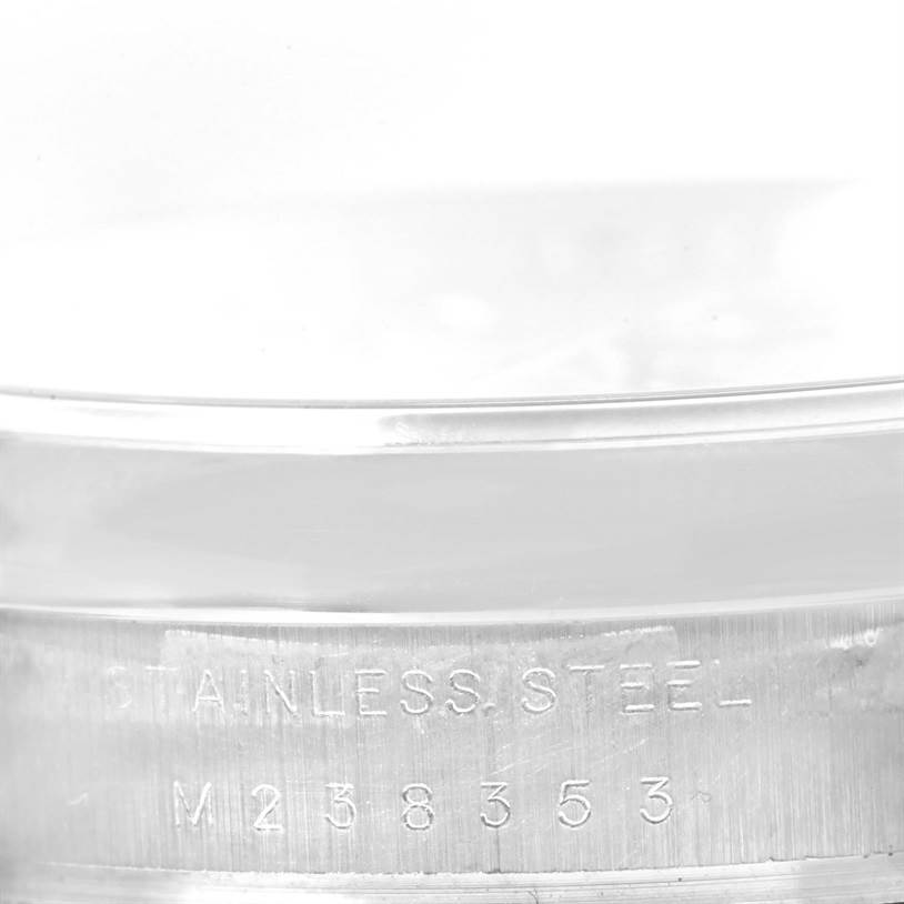 This image shows a close-up of the stainless steel casing and serial number of a Rolex Air-King 114200 Men's Stainless Steel Silver Dial 114200 Men's Stainless Steel Silver Dial watch.