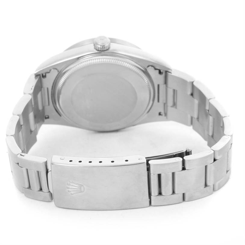The image shows the back view of a Rolex Air-King 14010 Men's Stainless Steel Silver Dial 14010 Men's Stainless Steel Silver Dial watch, displaying the case back and bracelet with the clasp slightly open.