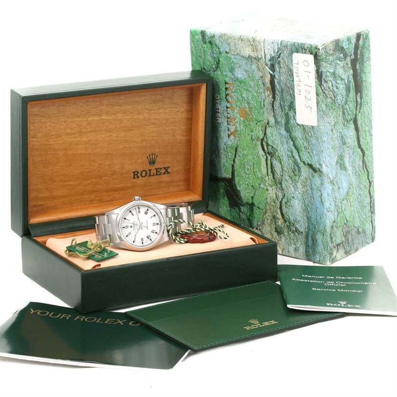 The Rolex Air-King 14000 Men's Stainless Steel White Dial 14000 Men's Stainless Steel White Dial watch is shown at a front angle inside its open box, alongside booklets and tags.