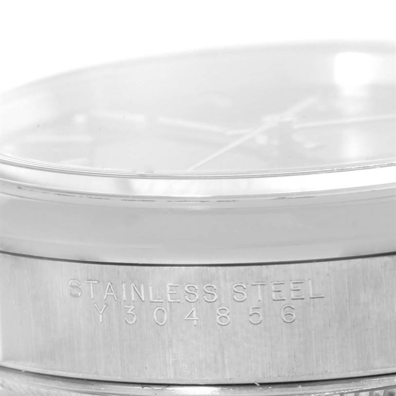 This image shows a close-up angle of the side of a Rolex Air-King 14000 Men's Stainless Steel Black Dial 14000 Men's Stainless Steel Black Dial watch, highlighting the stainless steel inscription and serial number.