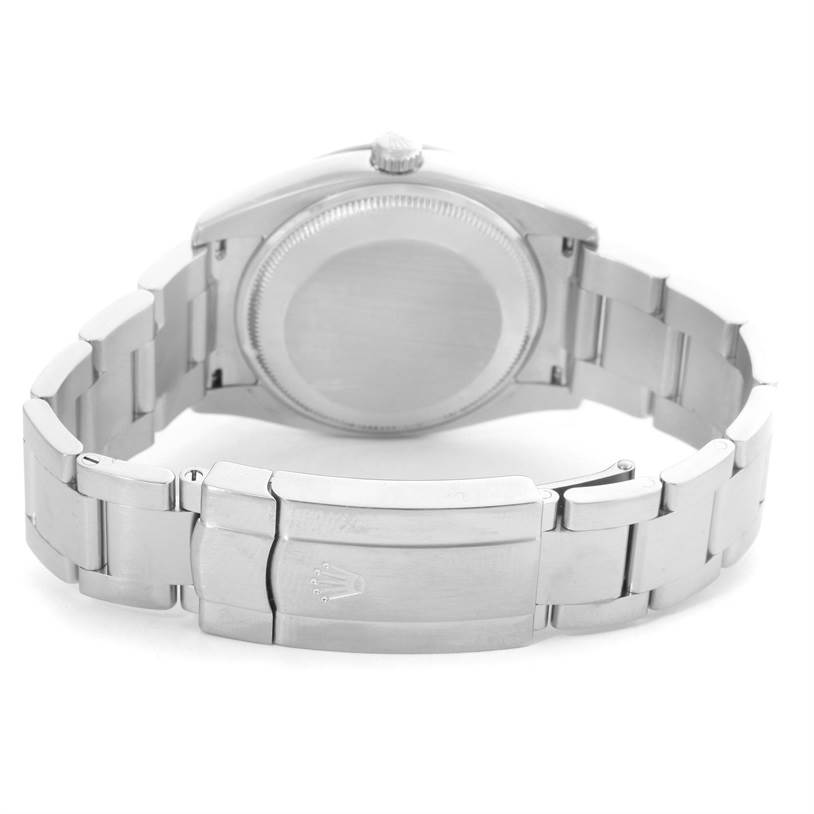 This image shows the back view of the Rolex Air-King 114210 Men's Stainless Steel Silver Dial 114210 Men's Stainless Steel Silver Dial watch, featuring its case back and metal bracelet clasp.