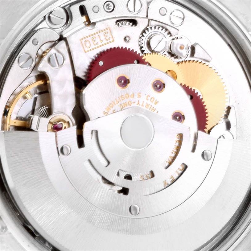 This image shows a close-up of the internal mechanical movement of a Rolex Air-King 114210 Men's Stainless Steel Silver Dial 114210 Men's Stainless Steel Silver Dial watch, revealing gears and intricate components.
