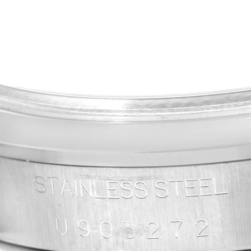 This image shows the engraved side of the stainless steel case back of a Rolex Air-King 14000 Men's Stainless Steel Black Dial 14000 Men's Stainless Steel Black Dial watch.