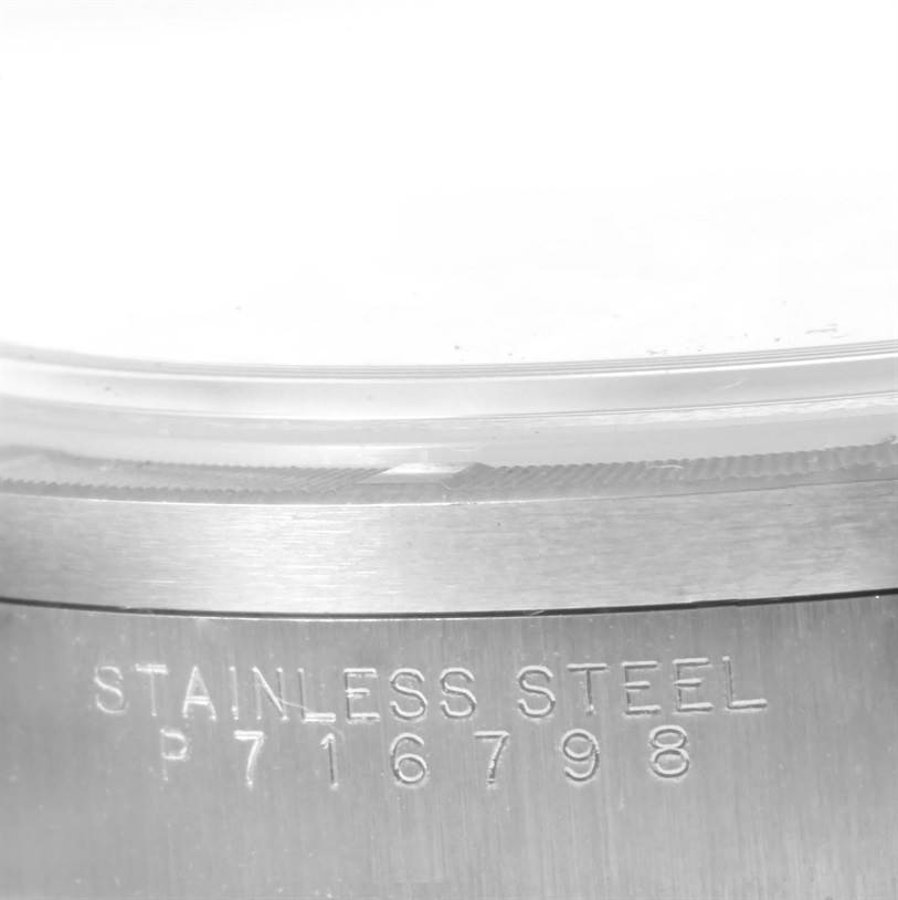 The image shows a close-up of the stainless steel caseback with engraved serial number of the Rolex Air-King 14010 Men's Stainless Steel Blue Dial 14010 Men's Stainless Steel Blue Dial watch.