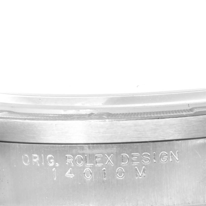 The image shows a close-up of the engraved side of the case of the Rolex Air-King 14010 Men's Stainless Steel Silver Dial 14010 Men's Stainless Steel Silver Dial model, displaying the design and model number.