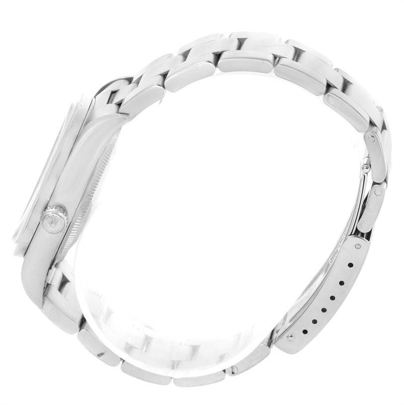 This side view of the Rolex Air-King 14010 Men's Stainless Steel Black Dial 14010 Men's Stainless Steel Black Dial watch shows the case, crown, and stainless steel bracelet.