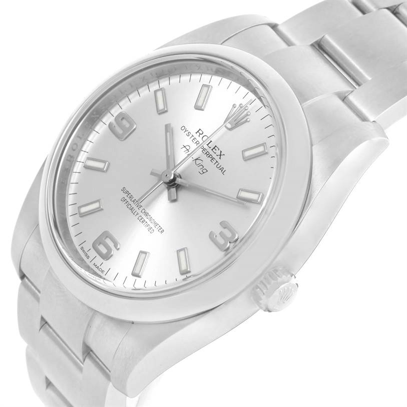 The image shows an angled view of the Rolex Air-King 114200 Men's Stainless Steel Silver Dial 114200 Men's Stainless Steel Silver Dial watch, highlighting the face, bezel, crown, and part of the stainless steel bracelet.