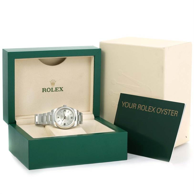 The image shows a Rolex Air-King 114200 Men's Stainless Steel Silver Dial 114200 Men's Stainless Steel Silver Dial watch in its branded open box with accompanying documentation next to the box.
