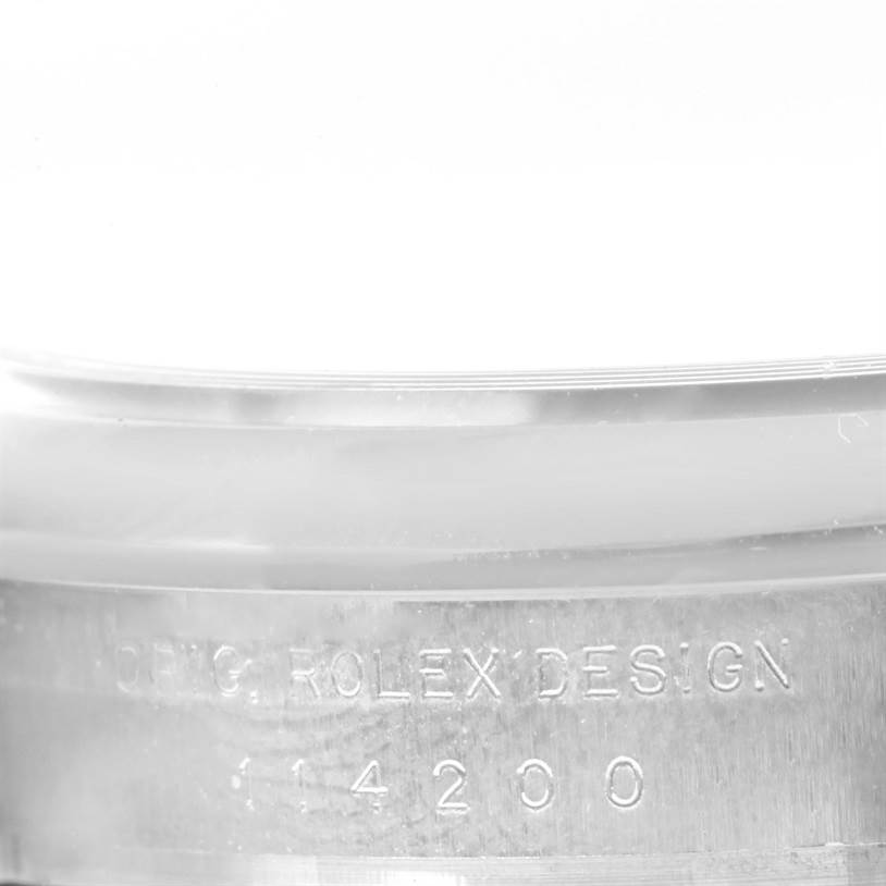 The image displays an angle showing the engraved text on the case side of the Rolex Air-King 114200 Men's Stainless Steel Silver Dial 114200 Men's Stainless Steel Silver Dial model.