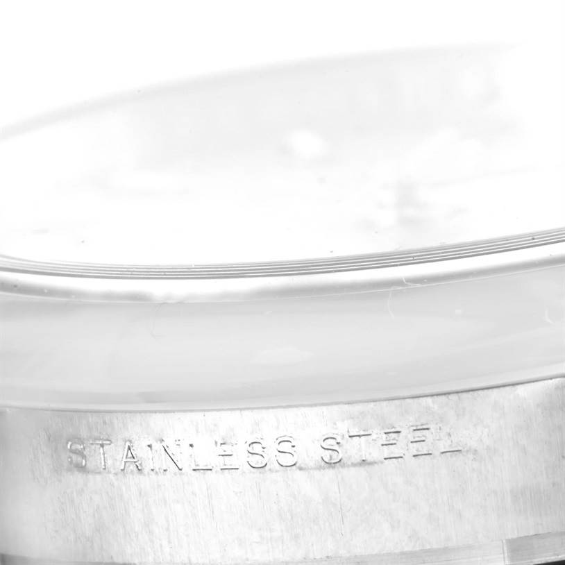 The image shows a close-up angle of the side of the Rolex Air-King 114200 Men's Stainless Steel Silver Dial 114200 Men's Stainless Steel Silver Dial watch, highlighting the "STAINLESS STEEL" engraving on the case.