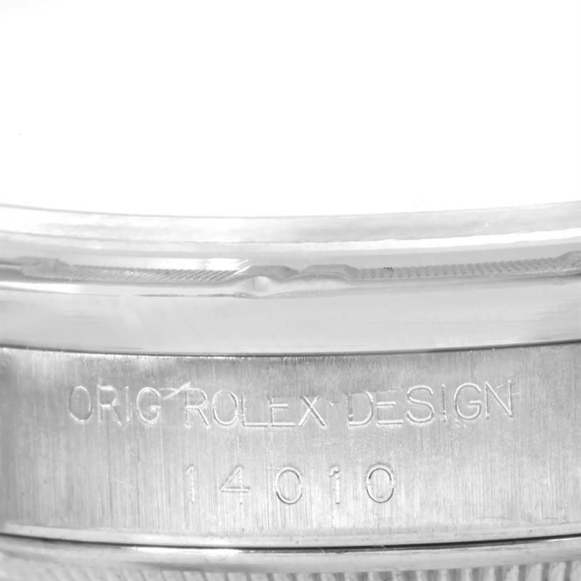 The image shows a close-up of the engraved caseback of the Rolex Air-King 14010 Men's Stainless Steel White Dial 14010 Men's Stainless Steel White Dial watch, displaying "ORIG ROLEX DESIGN" and the model number "14010".