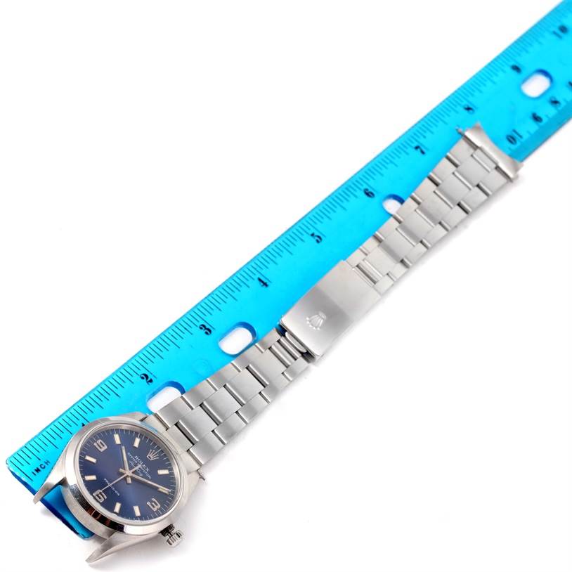 The image shows a Rolex Air-King 14000 Men's Stainless Steel Blue Dial 14000 Men's Stainless Steel Blue Dial watch laid flat next to a ruler, highlighting the face, bracelet, and clasp.