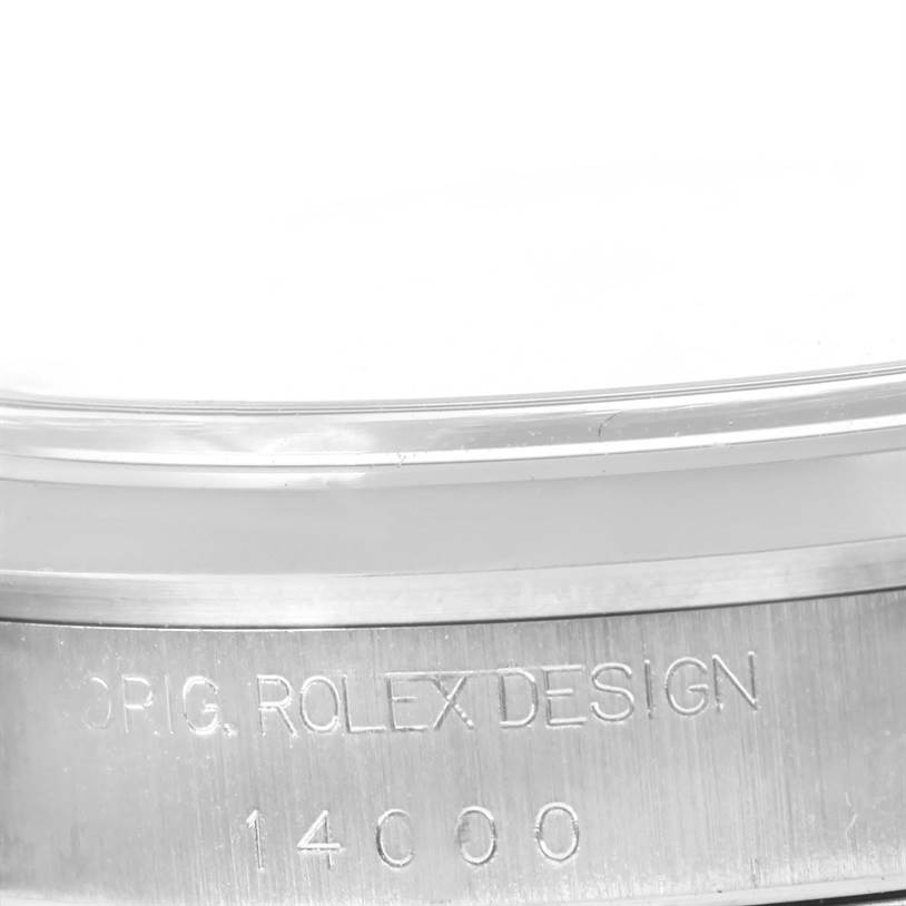 The image shows a close-up side view of the Rolex Air-King 14000 Men's Stainless Steel Blue Dial 14000 Men's Stainless Steel Blue Dial's case with the engraving "ORIG. ROLEX DESIGN 14000."