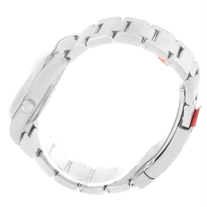 The image shows a side view of a Rolex Air-King 114200 Men's Stainless Steel Silver Dial 114200 Men's Stainless Steel Silver Dial watch, highlighting its case, bezel, crown, and part of the bracelet.