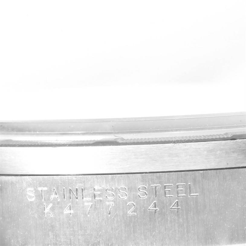 This image shows a close-up of the stainless steel case back of a Rolex Air-King 14010 Men's Stainless Steel Silver Dial 14010 Men's Stainless Steel Silver Dial, including its serial number.