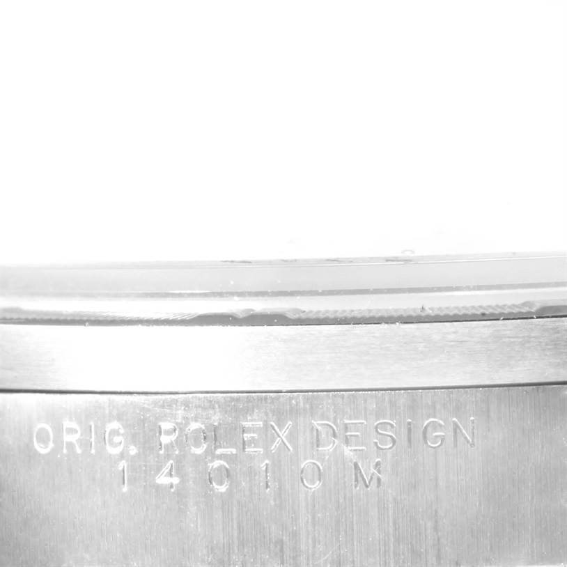 The image shows a close-up of the side of a Rolex Air-King 14010 Men's Stainless Steel Silver Dial 14010 Men's Stainless Steel Silver Dial watch, focusing on the engraved model number and design text.