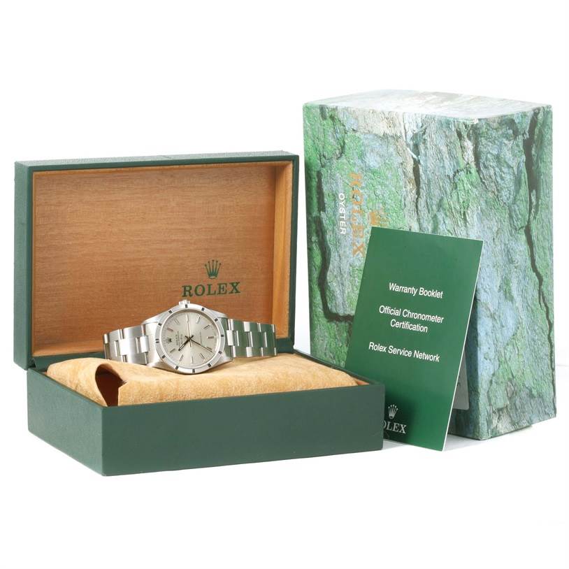 The image shows a Rolex Air-King 14010 Men's Stainless Steel Silver Dial 14010 Men's Stainless Steel Silver Dial watch placed inside its open green box, with a warranty booklet and outer packaging visible.