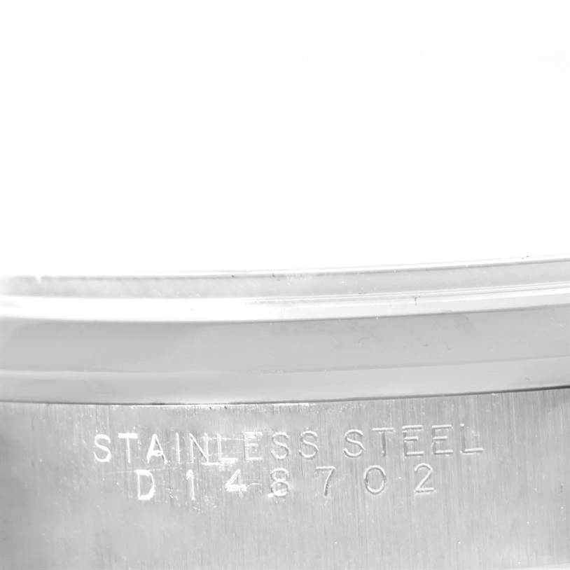 The image shows a close-up of the serial number and "STAINLESS STEEL" engraving on the caseback of a Rolex Air-King 14000 Men's Stainless Steel Silver Dial 14000 Men's Stainless Steel Silver Dial watch.