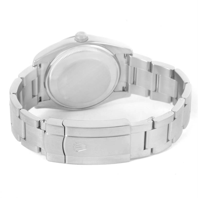 The image shows the back view of a Rolex Air-King 114200 Men's Stainless Steel Silver Dial 114200 Men's Stainless Steel Silver Dial watch, highlighting the case back and part of the metal bracelet with the clasp.