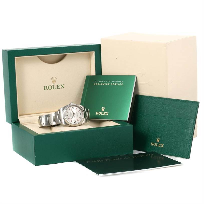 The image shows a Rolex Air-King 114200 Men's Stainless Steel Silver Dial 114200 Men's Stainless Steel Silver Dial watch in its open box with manuals and warranty cards displayed.