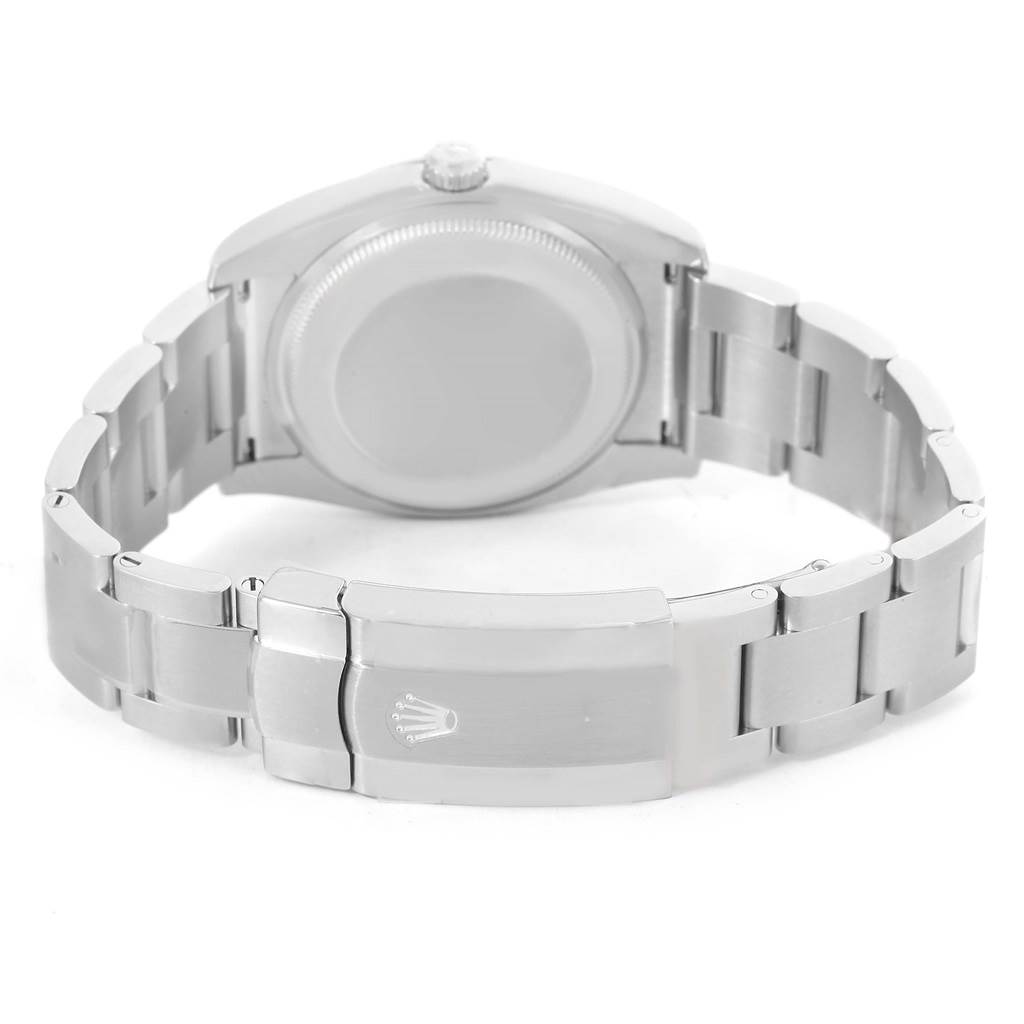 The image shows the back view of a Rolex Air-King 114200BLASO Men's Stainless Steel Blue Dial 114200BLASO Men's Stainless Steel Blue Dial watch, highlighting the case back and the closed clasp on the bracelet.