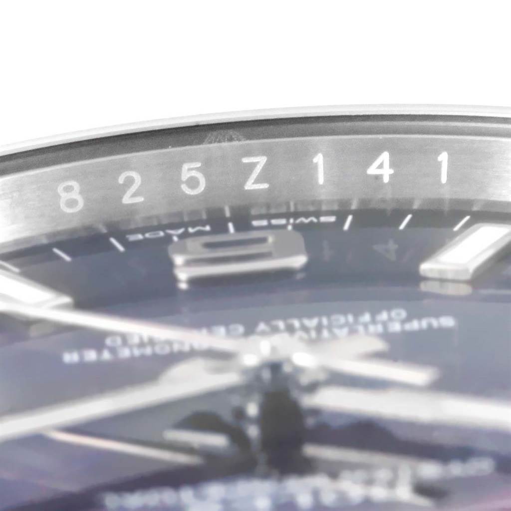The image shows a close-up angled view of the dial and bezel of a Rolex Air-King 114200BLASO Men's Stainless Steel Blue Dial 114200BLASO Men's Stainless Steel Blue Dial watch, highlighting the numerals and part of the text.