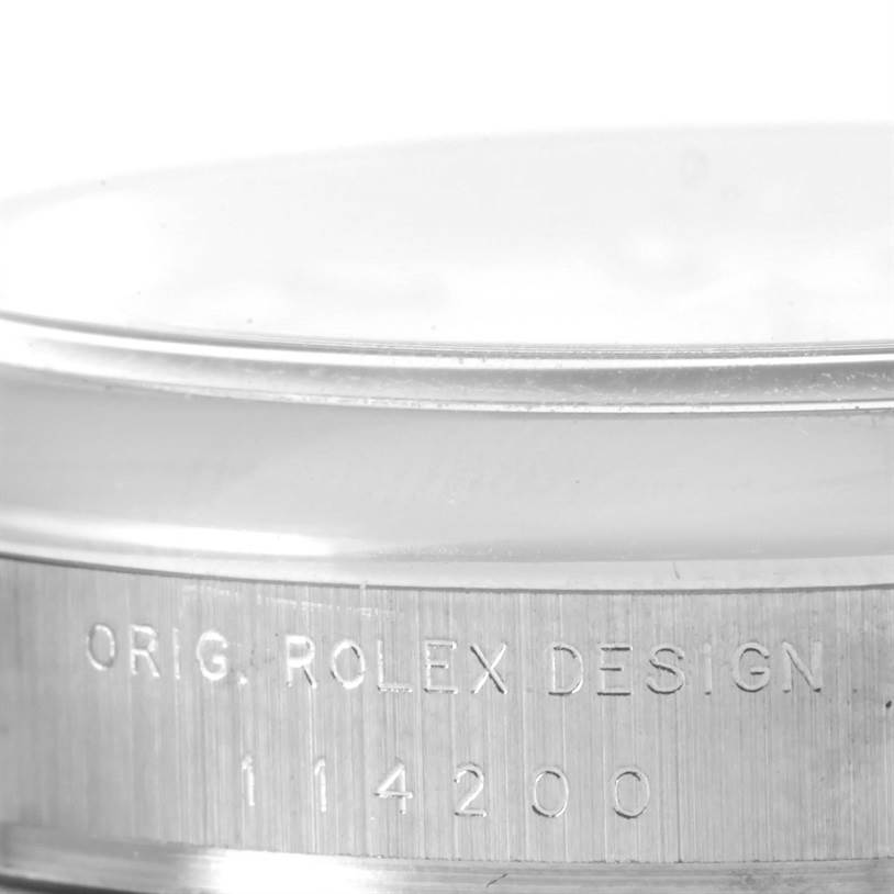 The image shows a close-up view of the case side of a Rolex Air-King 114200 Men's Stainless Steel White Dial 114200 Men's Stainless Steel White Dial watch, highlighting the model number engraving.