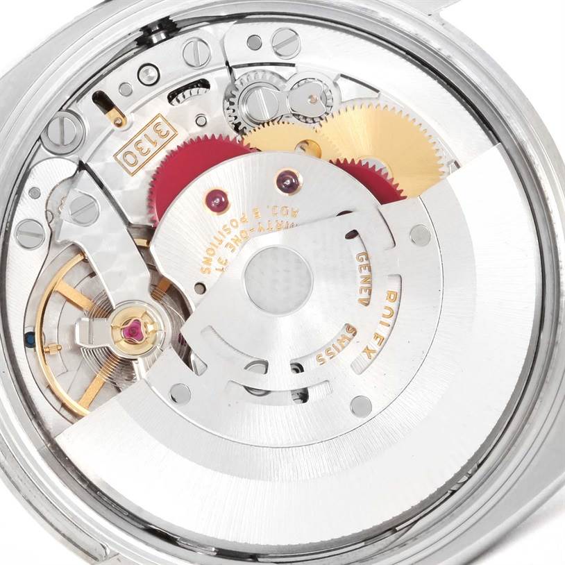 The image shows a close-up of the movement and internal gears of a Rolex Air-King 114200 Men's Stainless Steel White Dial 114200 Men's Stainless Steel White Dial watch.