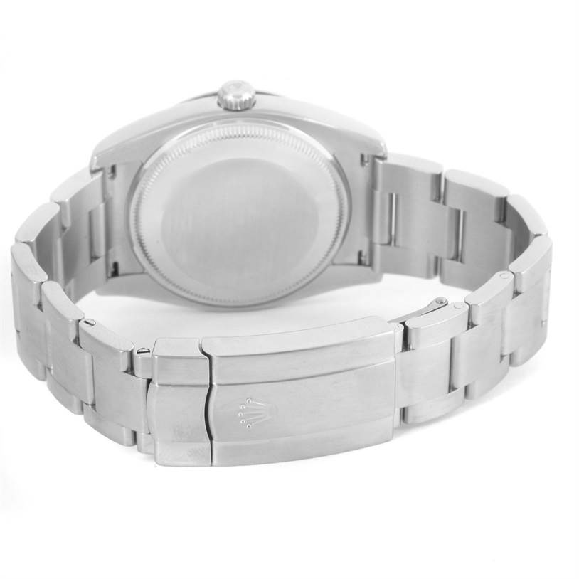 The image shows the back view of the Rolex Air-King 114200 Men's Stainless Steel White Dial 114200 Men's Stainless Steel White Dial watch, focusing on the case back and the closed bracelet clasp.