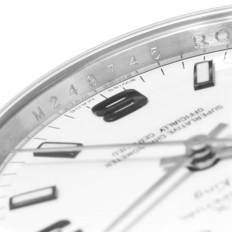 This close-up focuses on the bezel and partial dial of the Rolex Air-King 114200 Men's Stainless Steel White Dial 114200 Men's Stainless Steel White Dial, showcasing some numerals and engraving details.