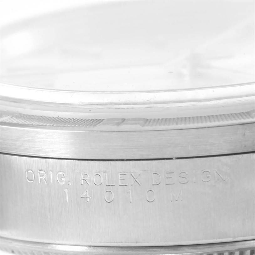 This close-up image shows the side of the Rolex Air-King 14010 Men's Stainless Steel Silver Dial 14010 Men's Stainless Steel Silver Dial watch, highlighting the engraved model number and bezel.