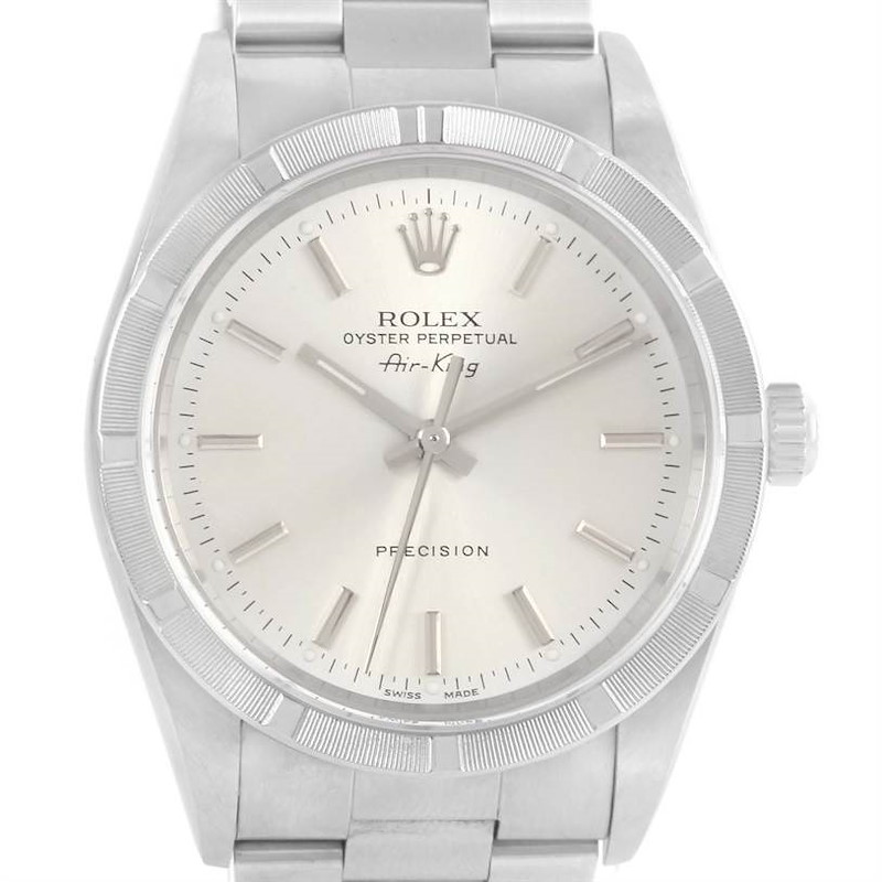 The Rolex Air-King watch is shown from a front angle, highlighting its dial, bezel, crown, and bracelet.