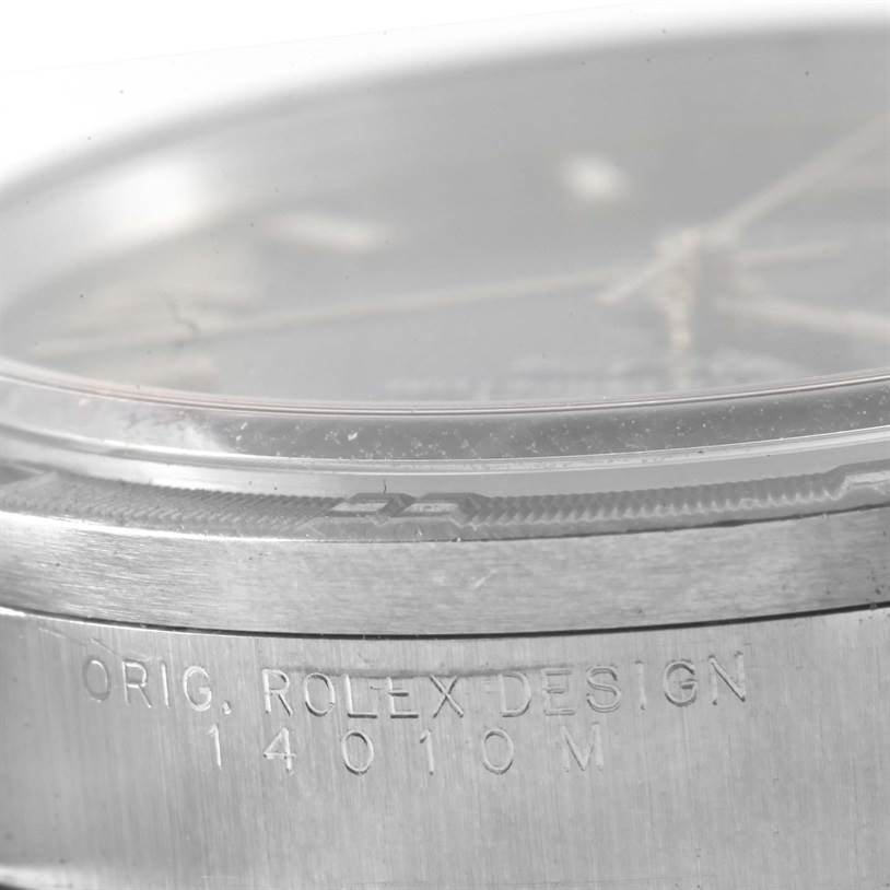 The image shows a close-up angle of the Rolex Air-King 14010 Men's Stainless Steel Blue Dial 14010 Men's Stainless Steel Blue Dial model, focusing on the edge of the watch case with engraved text.
