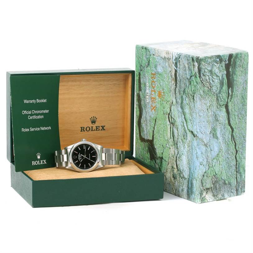 The image shows a front view of a Rolex Air-King 14000 Men's Stainless Steel Black Dial 14000 Men's Stainless Steel Black Dial watch in its box, alongside the outer packaging and accompanying booklets.