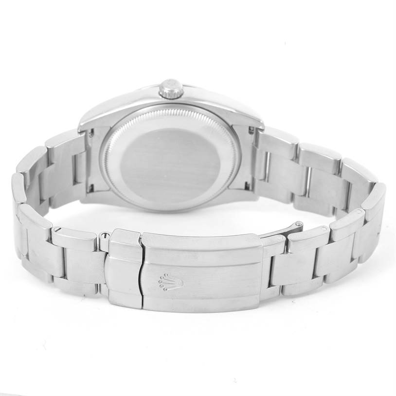 The image shows the back of the Rolex Air-King 114200 Men's Stainless Steel White Dial 114200 Men's Stainless Steel White Dial watch, highlighting its case back, crown, and metal bracelet with clasp.