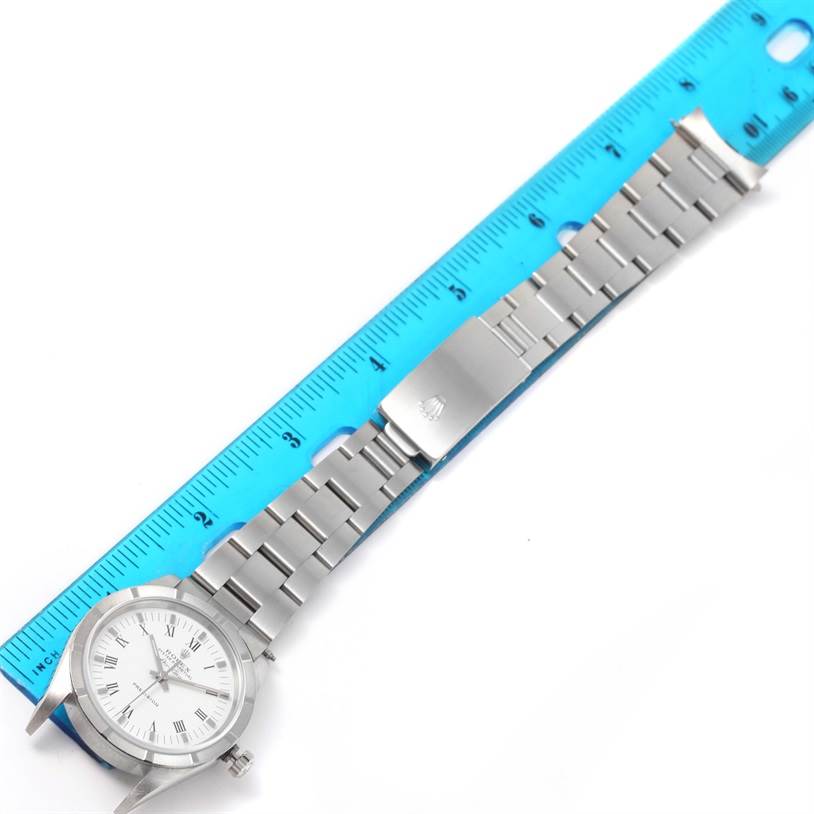 The image shows a Rolex Air-King 14010 Men's Stainless Steel White Dial 14010 Men's Stainless Steel White Dial watch laid flat next to a ruler, displaying the full length of the bracelet and the watch face.