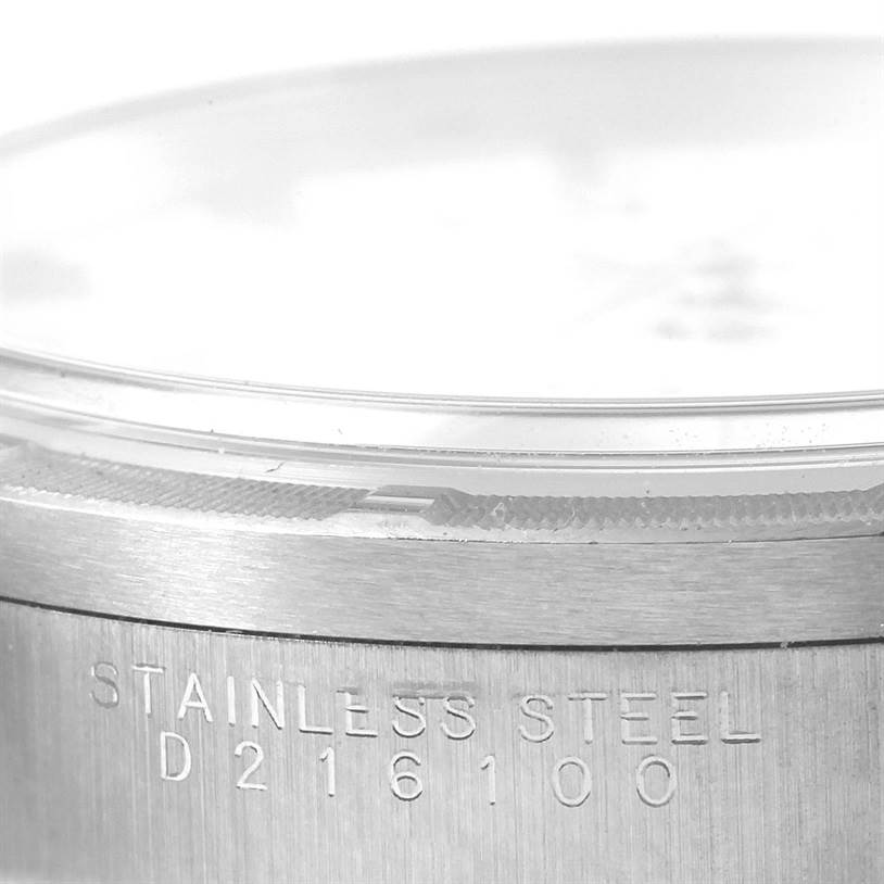 This image shows a close-up of the bezel and case of the Rolex Air-King 14010 Men's Stainless Steel White Dial 14010 Men's Stainless Steel White Dial watch, highlighting the engraving on the stainless steel.