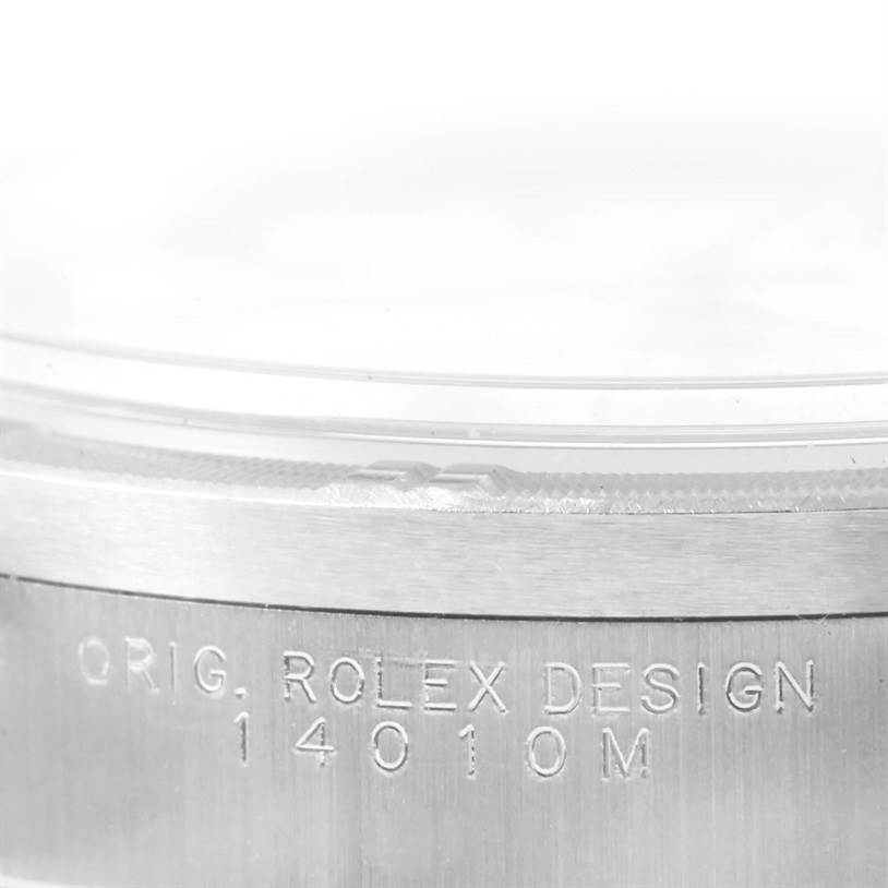 The image shows a close-up of the side of an Air-King model by Rolex, focusing on the engraved serial number and model details.