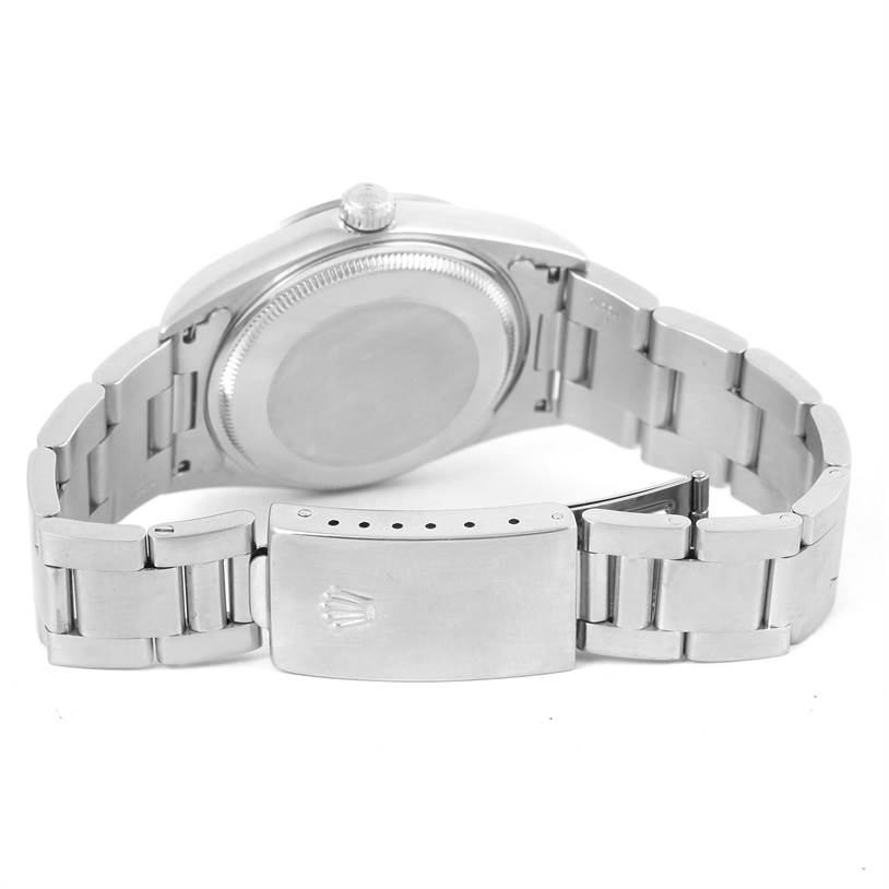 The image shows the back view of a Rolex Air-King 14000 Men's Stainless Steel White Dial 14000 Men's Stainless Steel White Dial watch, highlighting the case back and metal bracelet with a clasp.