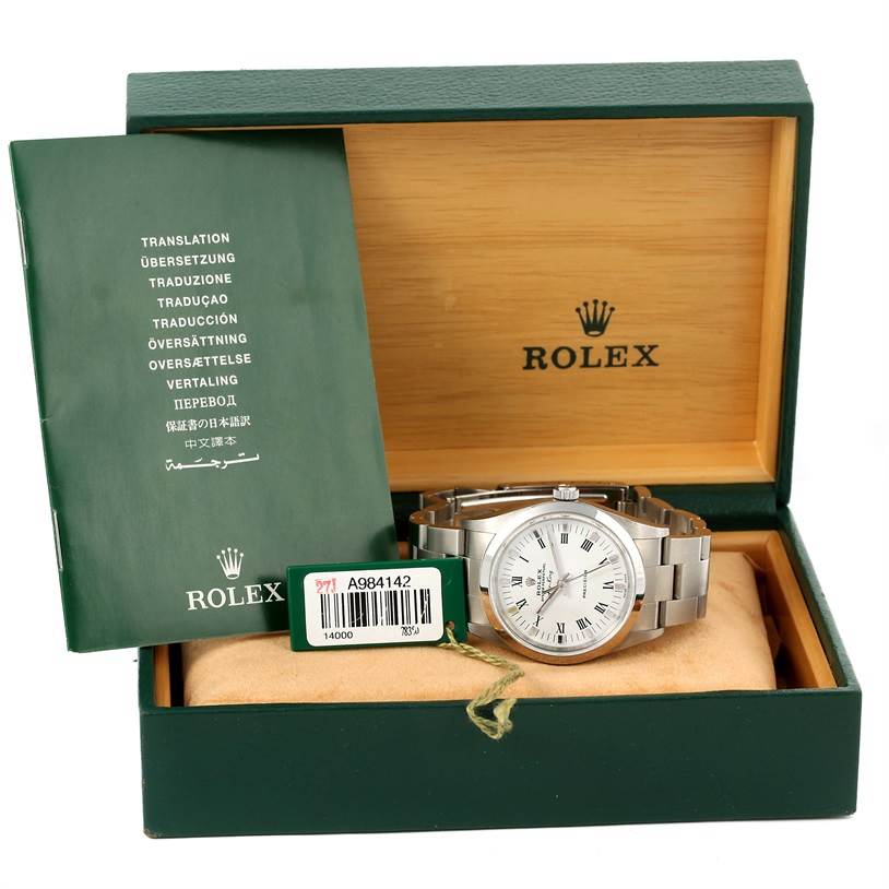 The image shows a Rolex Air-King 14000 Men's Stainless Steel White Dial 14000 Men's Stainless Steel White Dial watch in its open box with a manual and tag beside it.
