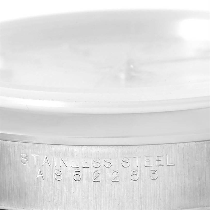 This image shows a close-up of the stainless steel case of a Rolex Air-King 14000 Men's Stainless Steel Silver Dial 14000 Men's Stainless Steel Silver Dial watch displaying its serial number.