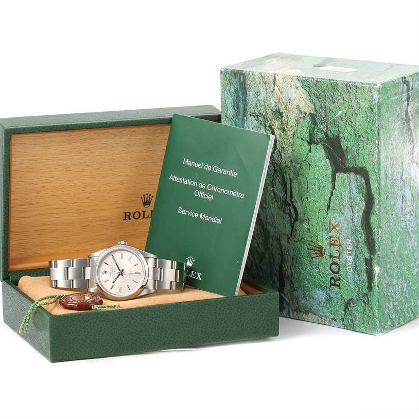 The image shows a Rolex Air-King 14000 Men's Stainless Steel Silver Dial 14000 Men's Stainless Steel Silver Dial watch, its box, manuals, and certification at a slightly high angle.