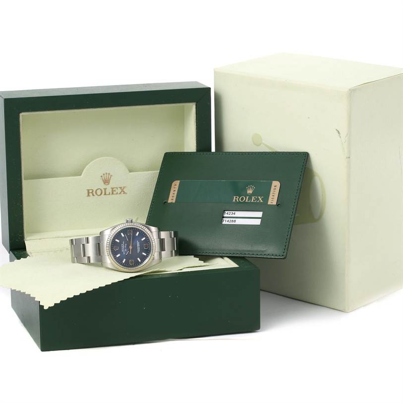 The image shows a Rolex Air-King 114234 Men's Stainless Steel Blue Dial 114234 Men's Stainless Steel Blue Dial watch, packaging box, warranty card holder, and cloth at a frontal angle.
