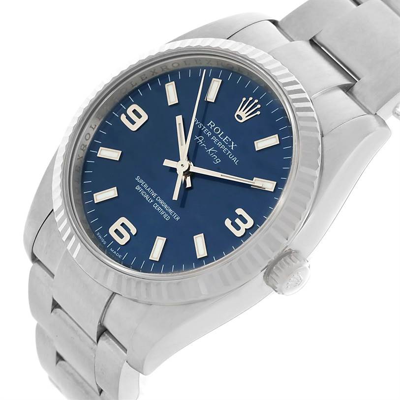 The Rolex Air-King 114234 Men's Stainless Steel Blue Dial 114234 Men's Stainless Steel Blue Dial watch is shown from a slightly tilted angle, displaying the face, bezel, crown, and part of the bracelet.