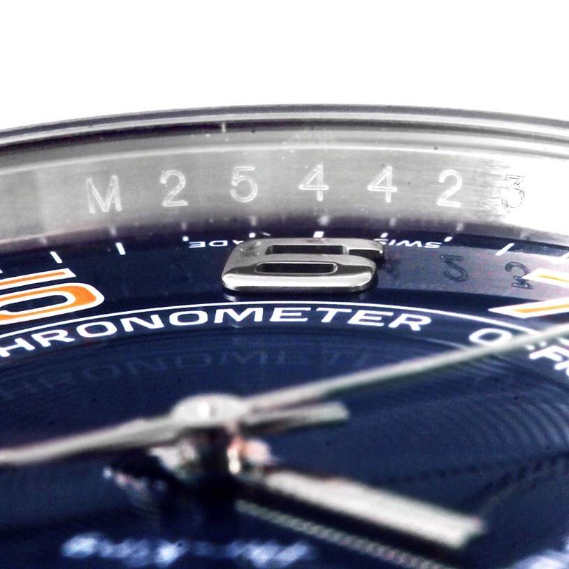 This close-up image of a Rolex Air-King 114200 Men's Stainless Steel Blue Dial 114200 Men's Stainless Steel Blue Dial watch shows the dial, hands, and part of the bezel with its serial number.
