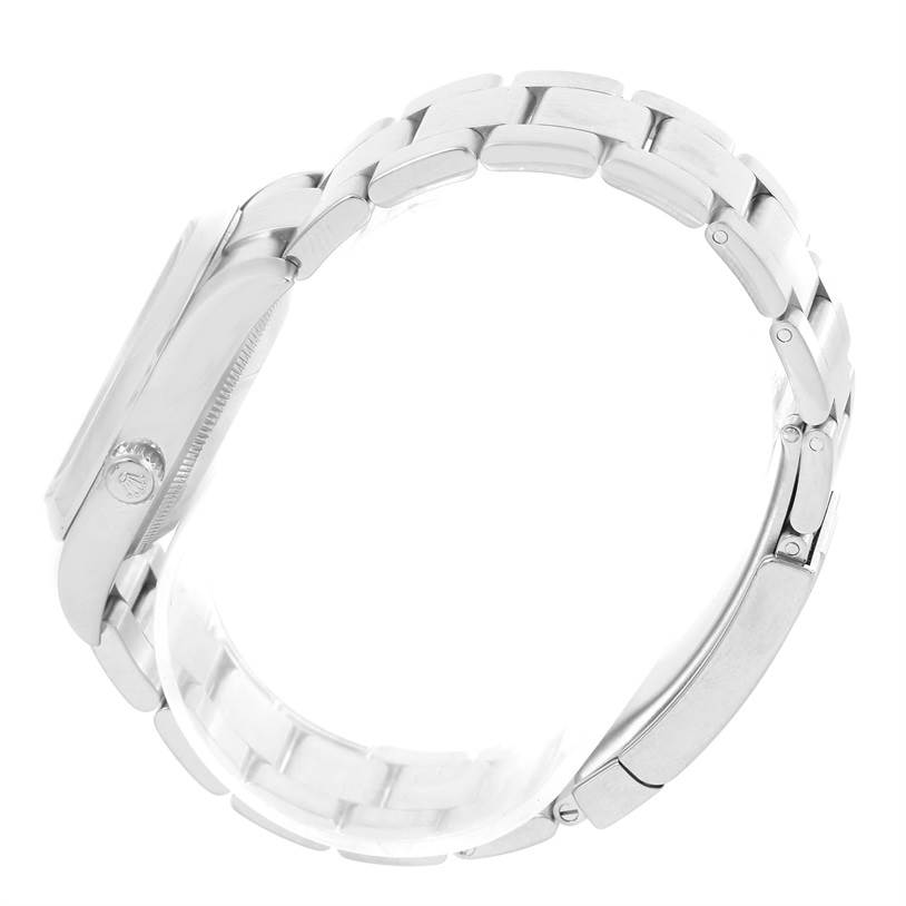 The image shows a side view of the Rolex Air-King 114200 Men's Stainless Steel Blue Dial 114200 Men's Stainless Steel Blue Dial watch, highlighting its case, crown, and bracelet.