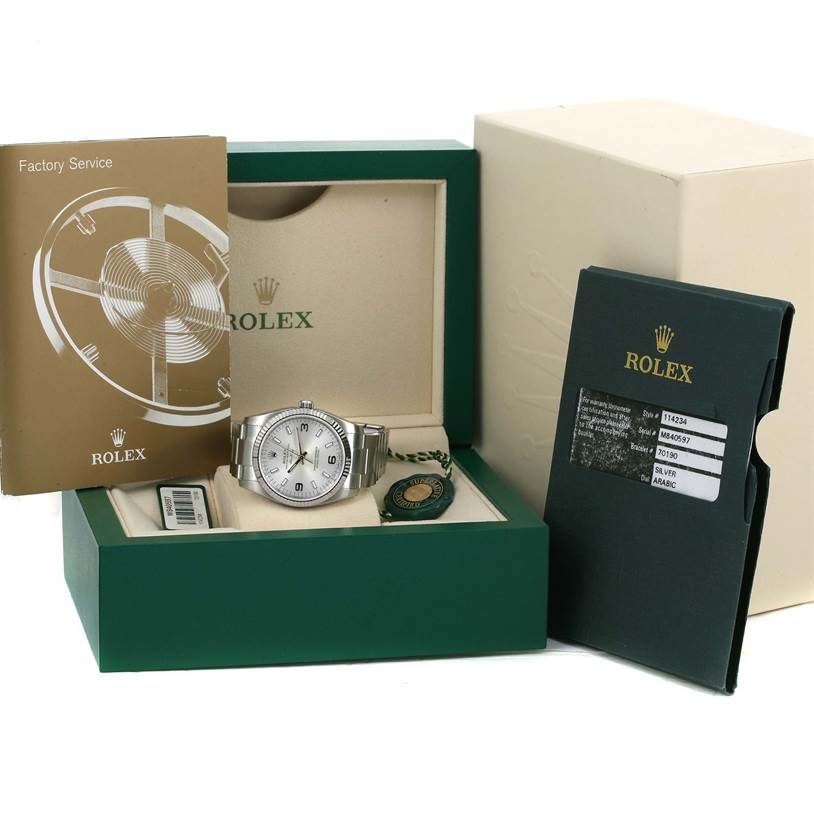 The image shows a head-on view of a Rolex Air-King 114234 Men's Stainless Steel Silver Dial 114234 Men's Stainless Steel Silver Dial watch in its box, along with booklets, a tag, and documentation.