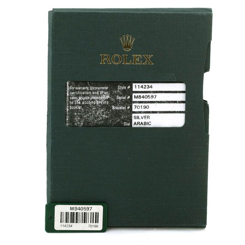 This image shows the green warranty card holder for a Rolex Air-King 114234 Men's Stainless Steel Silver Dial 114234 Men's Stainless Steel Silver Dial model with style, serial, bracelet, and dial information.
