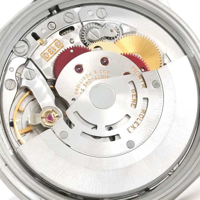 The image shows the internal mechanism of the Rolex Air-King 14010 Men's Stainless Steel Black Dial 14010 Men's Stainless Steel Black Dial watch, focusing on gears and the movement components.
