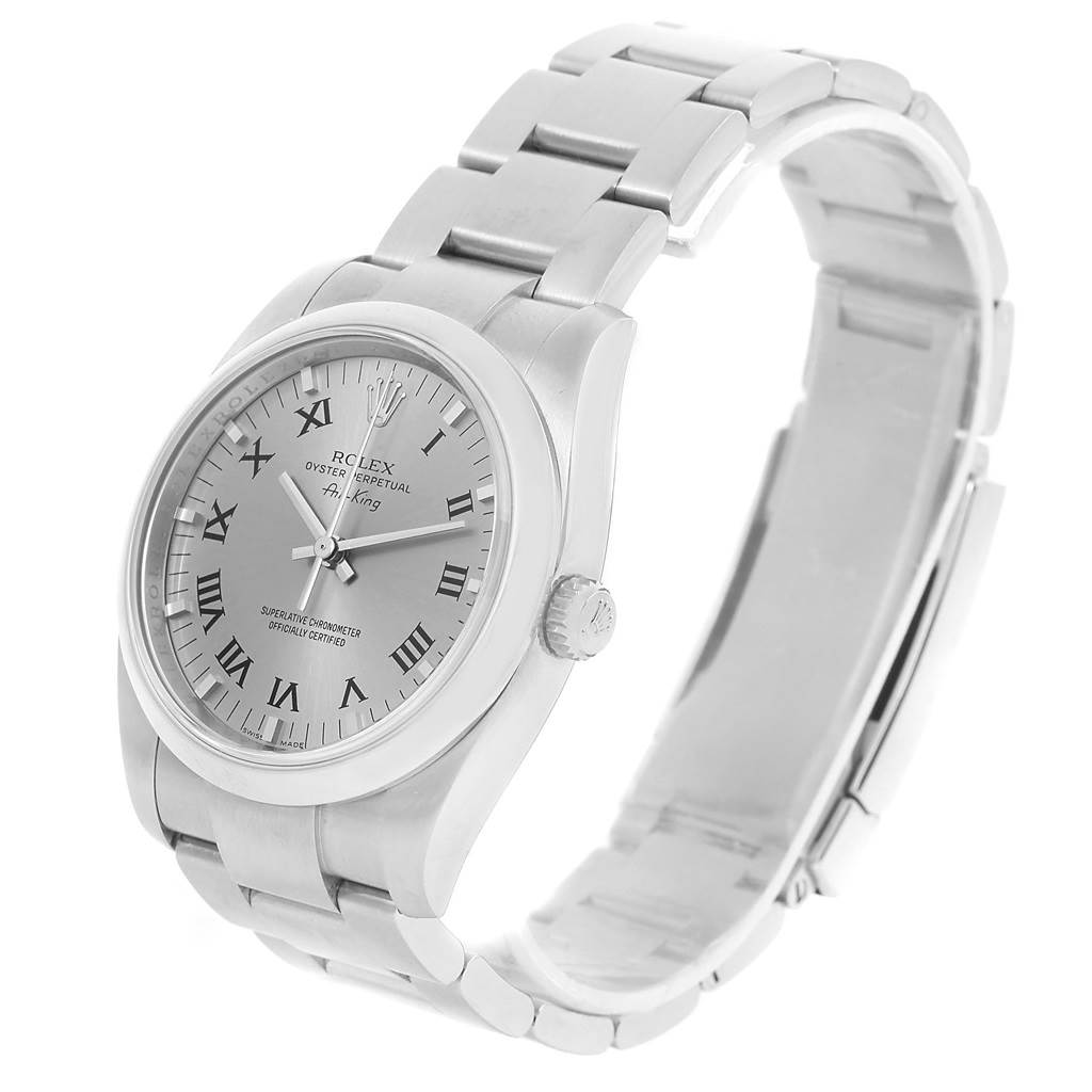 The Rolex Air-King 114200 Men's Stainless Steel Grey Dial 114200 Men's Stainless Steel Grey Dial watch is shown at a three-quarter angle, displaying its face, bezel, and part of the bracelet.